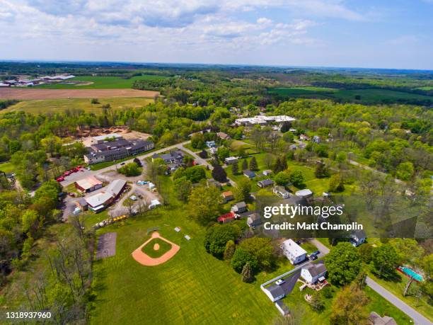 aerial of small town and baseball diamond - cittadina americana foto e immagini stock