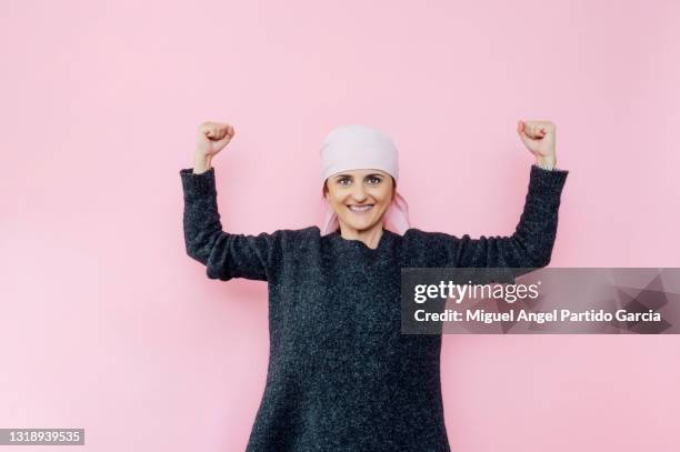 happy woman cancer patient on pink background. - miguel head stock pictures, royalty-free photos & images