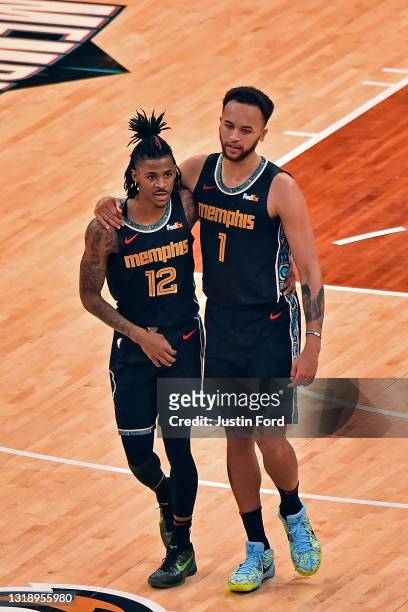 Ja Morant and Kyle Anderson of the Memphis Grizzlies during the second half of the play-in tournament game nio Spurs at FedExForum on May 19, 2021 in...