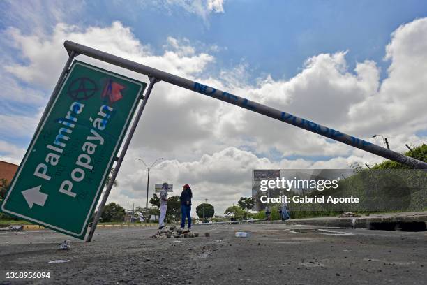 Street sign is used by protesters as a barricade which blocks the road that connects with the municipality of Palmira and the Alfonso Bonilla Aragon...