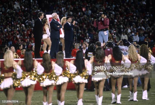 Joe Montana, Bill Walsh, Edward J. DeBartolo Jr. Attend Joe Montana day at Candlestick Park on March 16, 1997 in San Francisco, California.