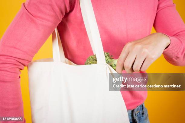 man with cloth bag and fruit and vegetables, organic - canvas bag stock pictures, royalty-free photos & images