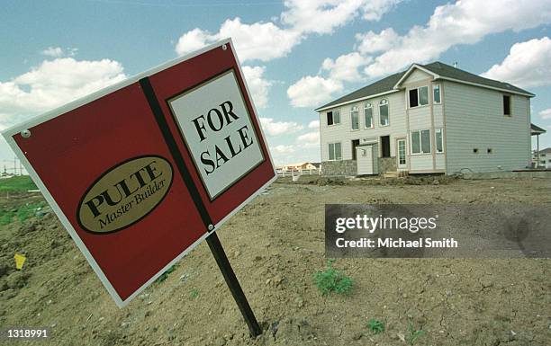 Real estate sign is displayed in front of a home under construction June 5, 2001 in Westminster, CO.