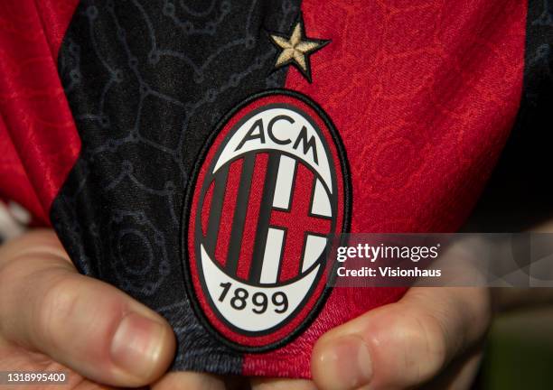 The AC Milan home shirt displaying the club badge on May 19, 2021 in Manchester, United Kingdom.