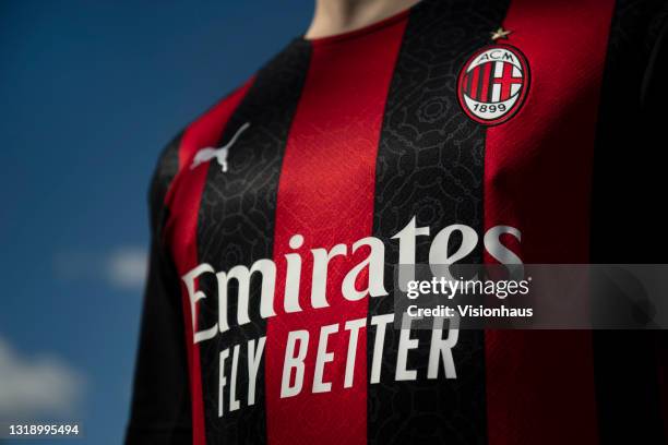 The AC Milan home shirt displaying the club badge and the shirt sponsor, Emirates airline on May 19, 2021 in Manchester, United Kingdom.