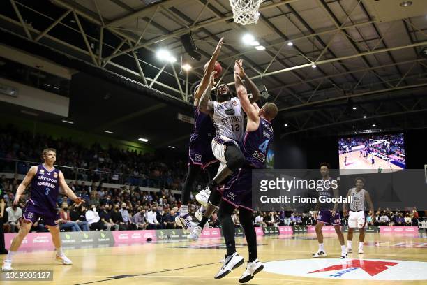 Jarell Martin of the Sydney Kings shoots under pressure from Corey Webster of the NZ Breakers and Colton Iverson of the NZ Breakers during the round...