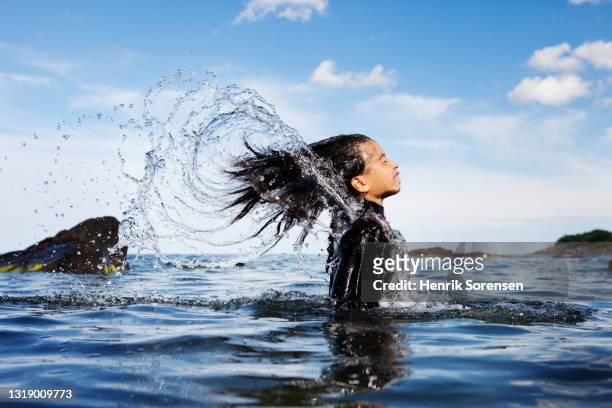 teenage girl in the ocean - girl liquid foto e immagini stock