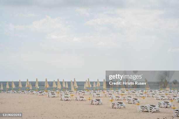 Empty sun loungers stacked up on a beach in the Bulgarian Black Sea resort of Albena on May 20, 2021 in Albena, Bulgaria. Bulgaria prepares for a...