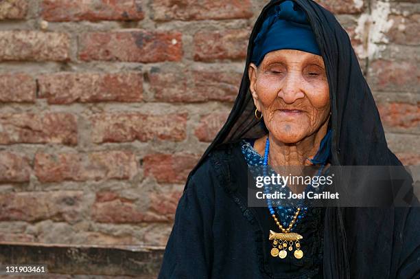 old arab woman outside home in luxor, egypt - up 103 86 stock pictures, royalty-free photos & images
