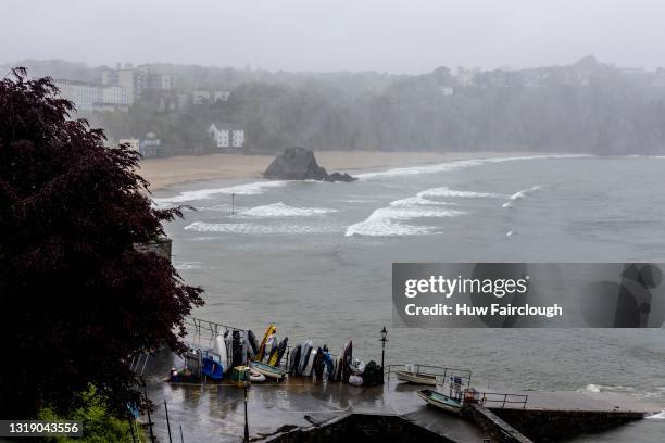 View of waves crashing on to St Catherine's Island and South Beach in high winds on May 20, 2021 in Tenby, Wales. The Met Office have issued a Yellow...