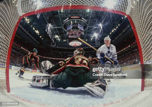 Manny Fernandez, Goalkeeper for the Minnesota Wild saves the shot from Mats Sundin, Captain and Center for the Toronto Maple Leafs during the NHL...