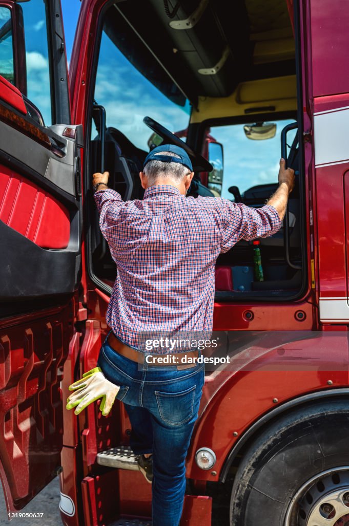 Mature truck driver preparing to hit the road