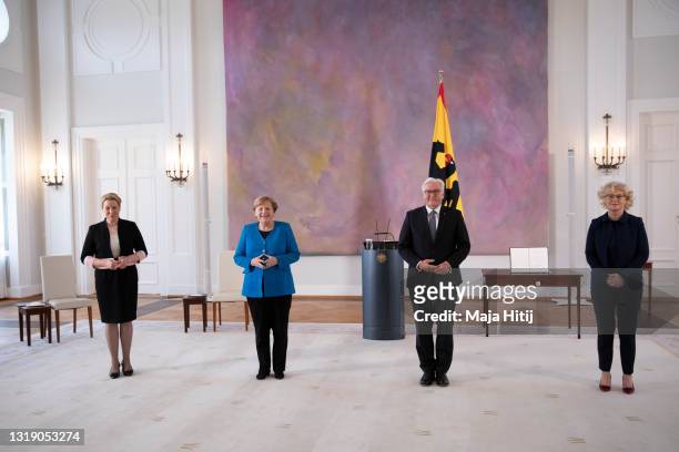 German President Frank-Walter Steinmeier and Chancellor Angela Merkel pose with outgoing Families Minister Franziska Giffey and German Justice...