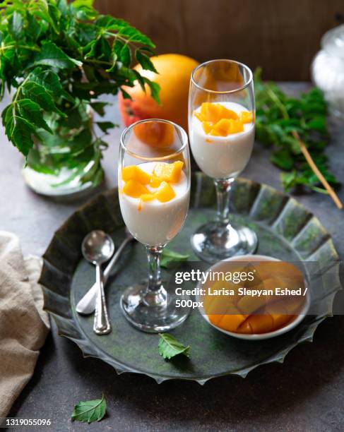 high angle view of drinks with fruits on table - lassi stock pictures, royalty-free photos & images