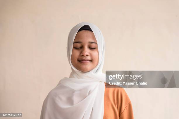 teenager muslim girl - indonesian girl stock pictures, royalty-free photos & images