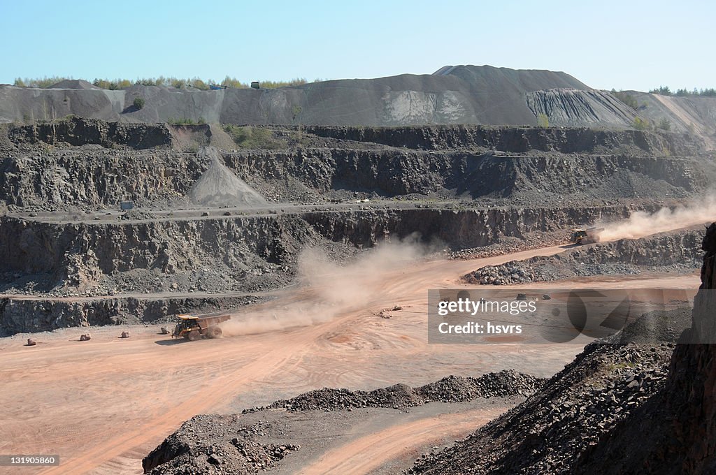 Open-pit Mine with two Dump Trucks