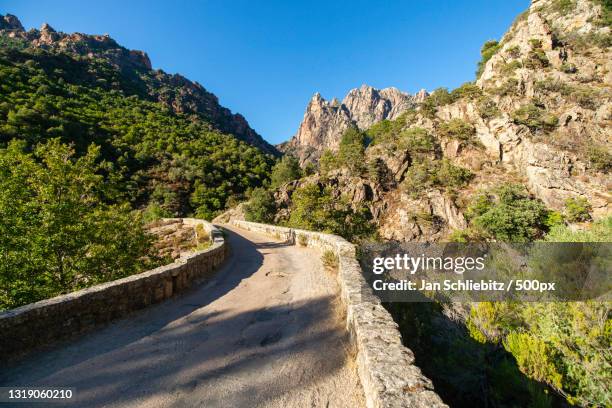 empty road along mountain - cargese bildbanksfoton och bilder