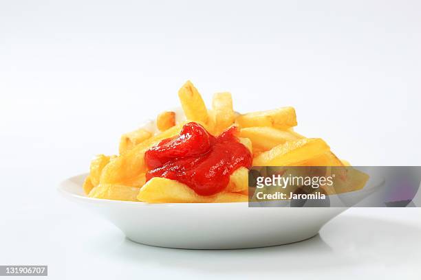 french fries with ketchup - frites stock pictures, royalty-free photos & images