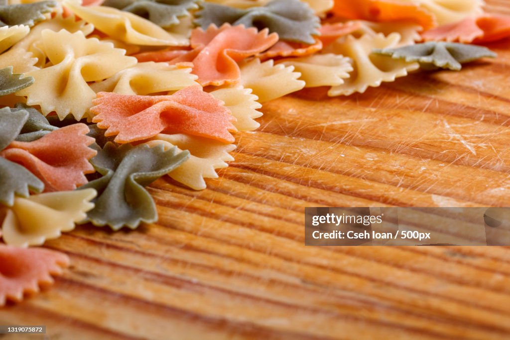Close-up of raw pasta on table
