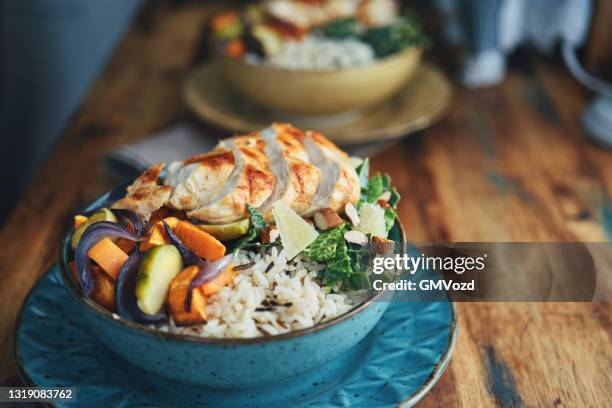 farmers harvest chicken rice bowl - bowl stock pictures, royalty-free photos & images
