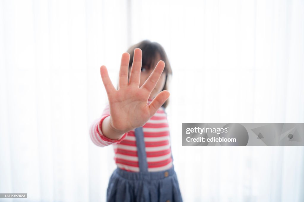 Girl making stop gesture
