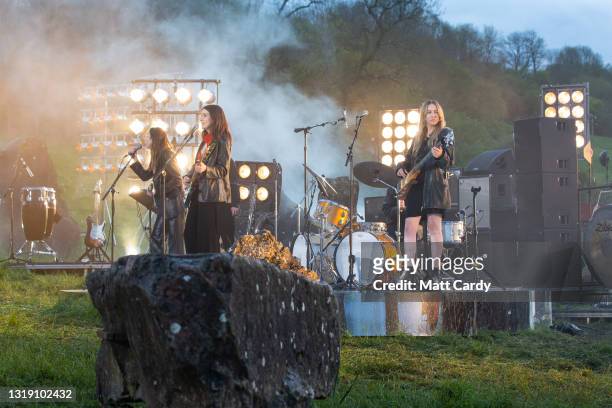 In this image released on May 21st, HAIM perform in the Stone Circle as part of the Glastonbury Festival Global Livestream “Live at Worthy Farm” at...