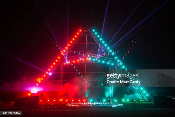 In this image released on May 21st, the main Pyramid Stage is illuminated during the production of the Glastonbury Festival Global Livestream “Live...