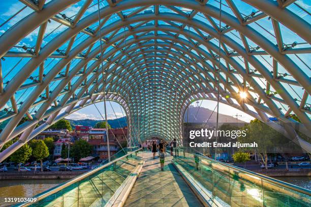 remarkable bridge of peace, tbilisi, georgia - tbilisi river kura stock pictures, royalty-free photos & images