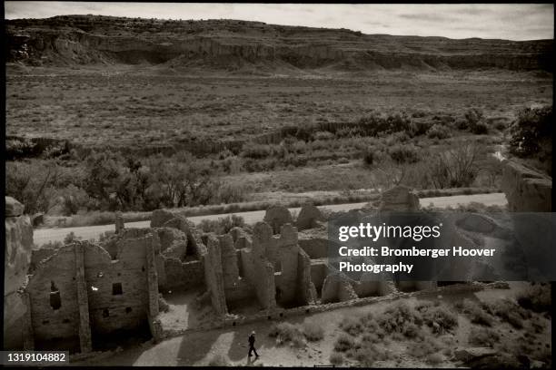 High angle view of Chaco Canyon National Historical Park, New Mexico, 1995. An unidentified tourist is visible at bottom. A cultural center for the...