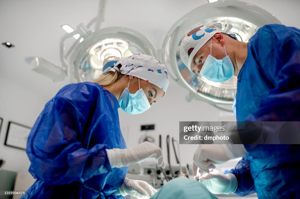 Dental team performing procedure