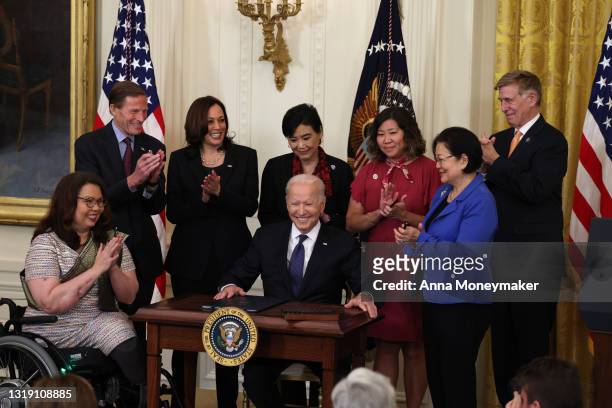 President Joe Biden smiles after signing the COVID-19 Hate Crimes Act into law, as Sen. Tammy Duckworth , Sen. Richard Blumenthal , Vice President...