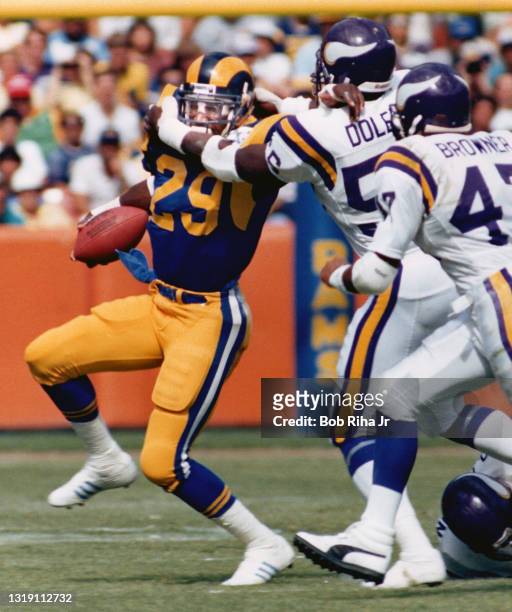 Los Angeles Rams running back Eric Dickerson runs for a short gain against Minnesota Vikings, October 6, 1985 in Anaheim, California.