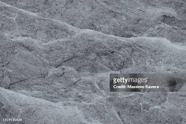 stone texture in black tones - roccia foto e immagini stock