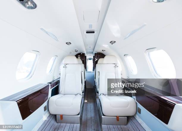 interior of empty corporate airplane - vehicle interior stock pictures, royalty-free photos & images