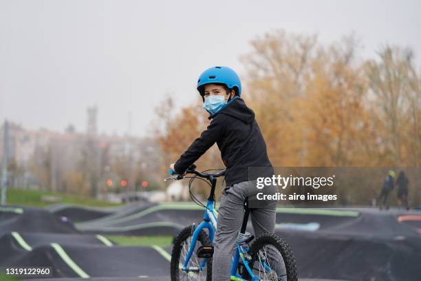 Kid Enjoying While Riding A Bike On A Pumptrack High-Res Stock Photo