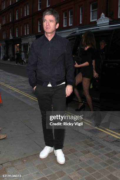 Noel Gallagher and Sara MacDonald seen on a night out at Chiltern Firehouse on May 20, 2021 in London, England.