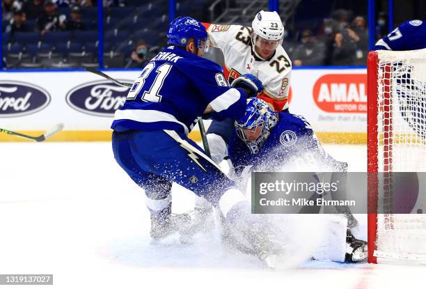 Andrei Vasilevskiy of the Tampa Bay Lightning stops a shot from Carter Verhaeghe of the Florida Panthers during Game Three of the First Round of the...