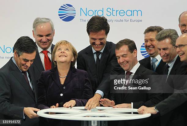 French Prime Minister Francois Fillon, German Chancellor Angela Merkel, Dutch Prime Minister Mark Rutte, Russian President Dmitry Medvedev and...
