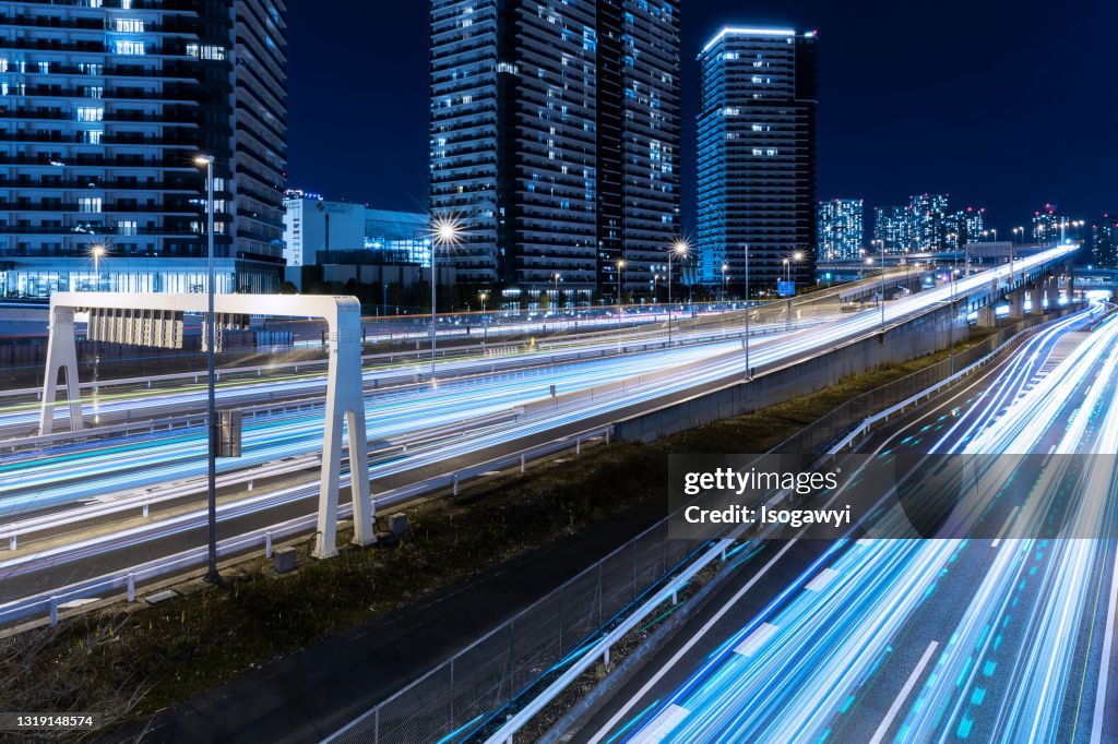 Traffic Light Trails And Illuminated Buildings At Tokyo Waterfront Area