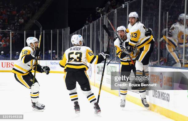 The Pittsburgh Penguins celebrate the game winning goal by Brandon Tanev against the New York Islanders at 16:24 of the third period in Game Three of...