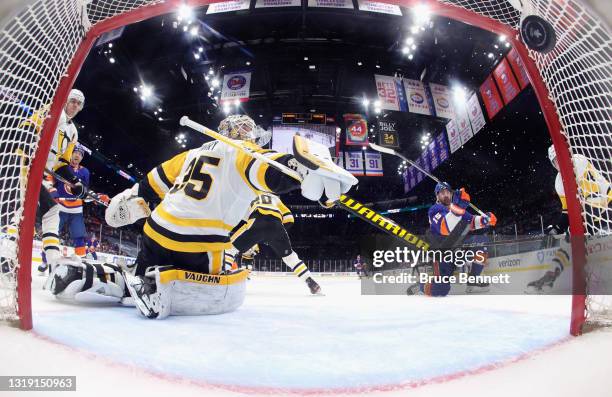 Cal Clutterbuck of the New York Islanders scores at 14:17 of the third period against Tristan Jarry of the Pittsburgh Penguins in Game Three of the...