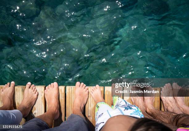 family on the pier - looking down at feet stock pictures, royalty-free photos & images