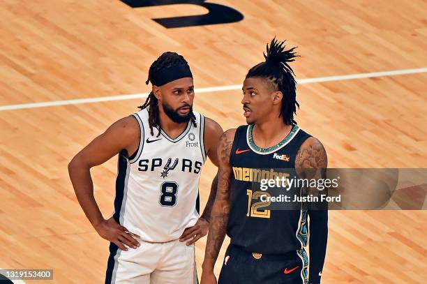 Patty Mills of the San Antonio Spurs and Ja Morant of the Memphis Grizzlies during the game of the play-in tournament game at FedExForum on May 19,...