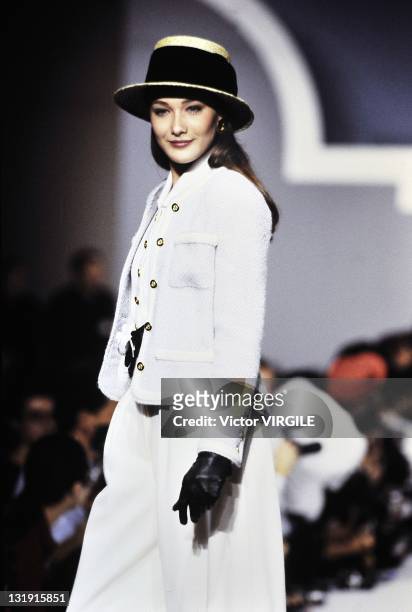 Model Carla Bruni-Sarkozy walks the runway during the Chanel Ready to Wear Spring/Summer 1989 show as part of the Paris Fashion Week on October 24,...