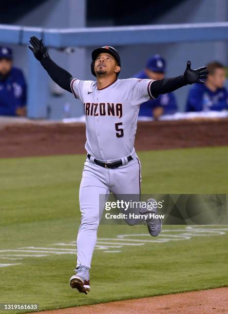 Eduardo Escobar of the Arizona Diamondbacks celebrates his two run homerun, to tie the game 2-2 with the Los Angeles Dodgers, during the sixth inning...