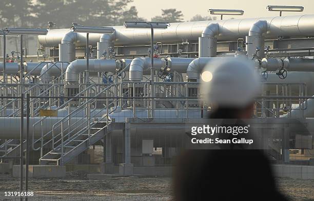 Man wearing a hard hat looks out at the central facility where the Nord Stream Baltic Sea gas pipeline reaches western Europe following the...