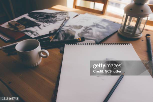 professional artist's studio work desk - sketch pad stock pictures, royalty-free photos & images