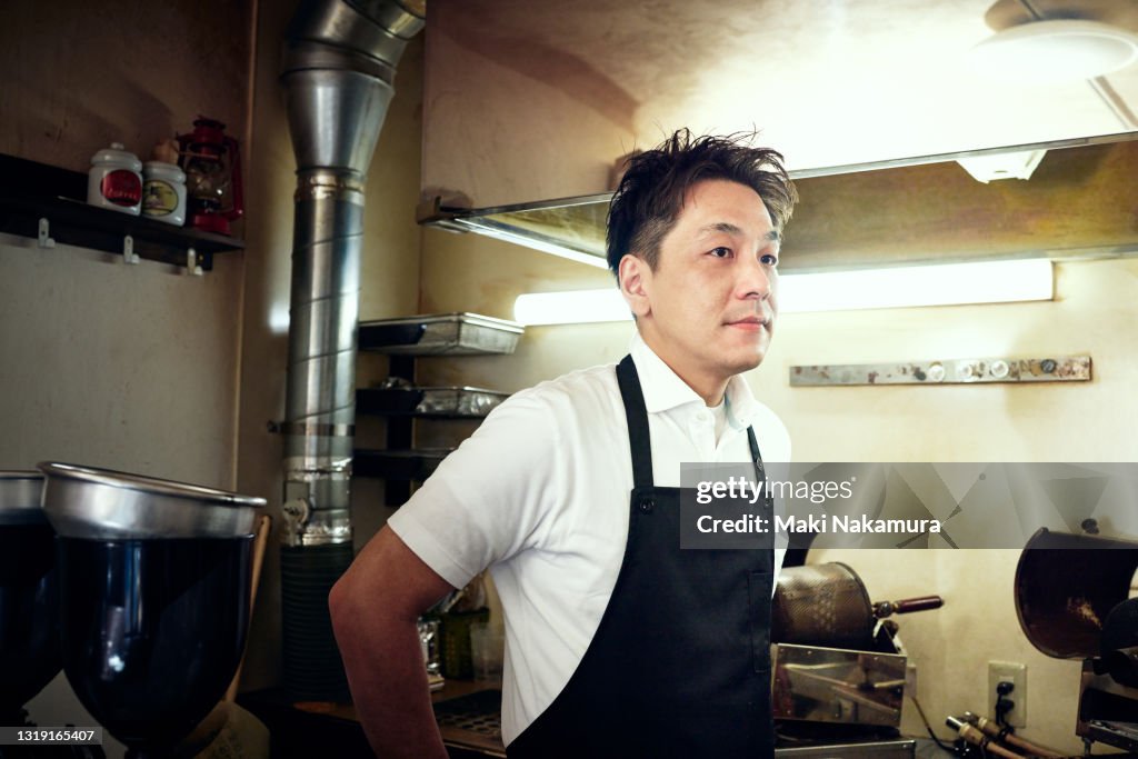 Portrait of a man resting in the kitchen.