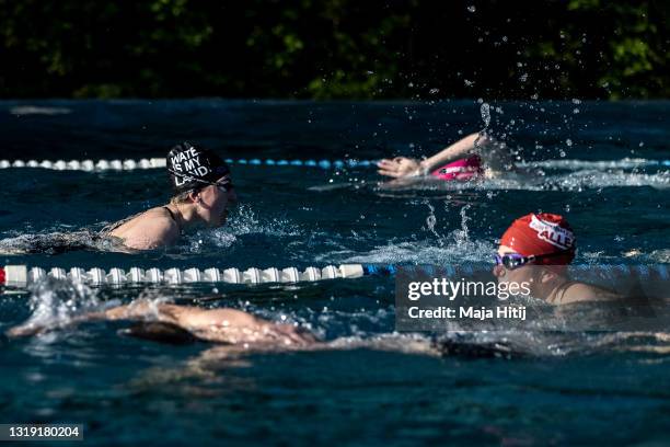 Swimmers exercise in an open air pool during the coronavirus pandemic on May 21, 2021 in Berlin, Germany. Authorities are easing lockdown measures...