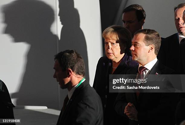 German Chancellor Angela Merkel and Russian President Dmitry Medvedev arrive to turn a wheel with other European leaders to symbolically start the...